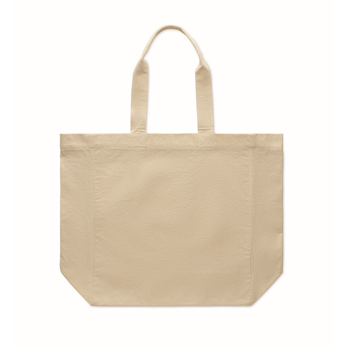 Bolsa de algodón grueso con asas cortas y fuelle.